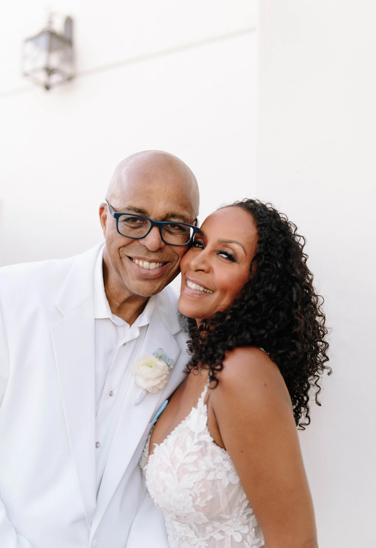 Angela and Ken smiling together on their wedding day